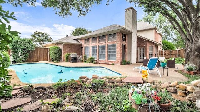 6740 Magnum Dr, Plano, TX 75024 - view of swimming pool with a patio area, a fenced backyard, and area for grilling