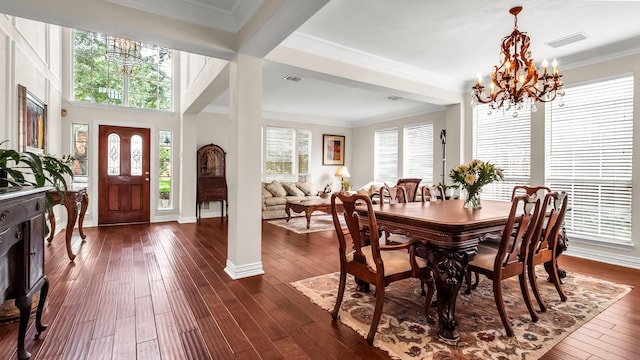 6740 Magnum Dr, Plano, TX 75024 - dining area with a chandelier, dark wood finished floors, and crown molding