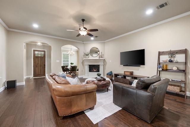 8240 Odell St, North Richland Hills, TX 76182 - living area featuring arched walkways, a ceiling fan, dark wood-style flooring, crown molding, and recessed lighting