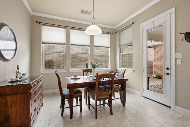 8240 Odell St, North Richland Hills, TX 76182 - dining space with plenty of natural light, ornamental molding, and light tile patterned floors