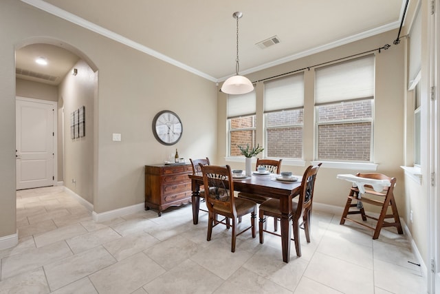 8240 Odell St, North Richland Hills, TX 76182 - dining room with arched walkways and crown molding