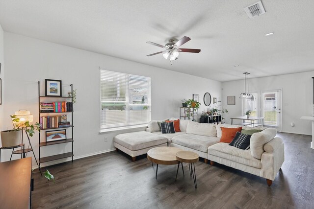 9009 Benevolent Ct, Providence Village, TX 76227 - living area with healthy amount of natural light, dark wood finished floors, and a ceiling fan