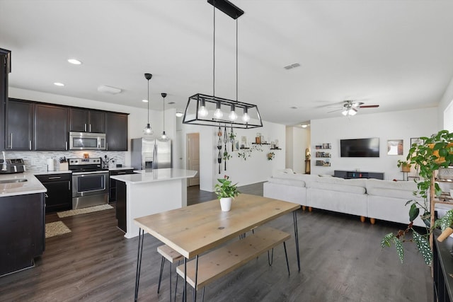 9009 Benevolent Ct, Providence Village, TX 76227 - dining room with ceiling fan, dark wood-style flooring, and recessed lighting
