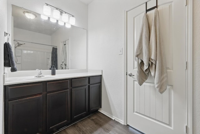 9009 Benevolent Ct, Providence Village, TX 76227 - bathroom featuring wood finished floors, vanity, and a shower with shower curtain