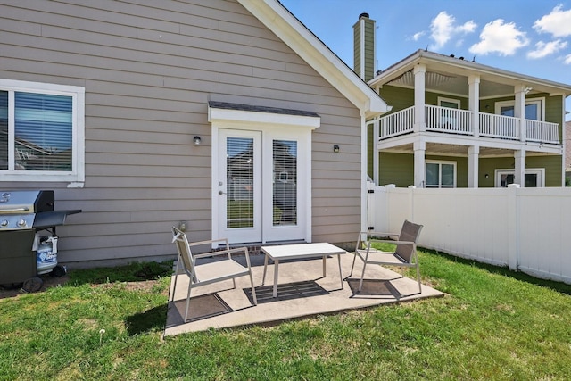 9009 Benevolent Ct, Providence Village, TX 76227 - rear view of property featuring a chimney, a patio, and a balcony