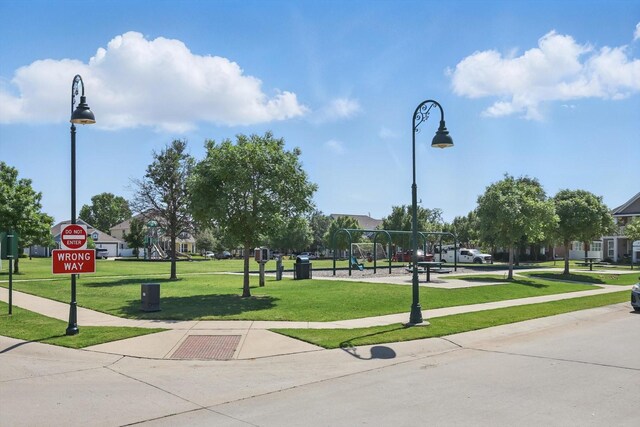 9009 Benevolent Ct, Providence Village, TX 76227 - view of home's community with a lawn