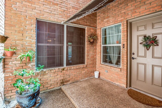 17342 Remington Park Pl, Dallas, TX 75252 - doorway to property featuring brick siding