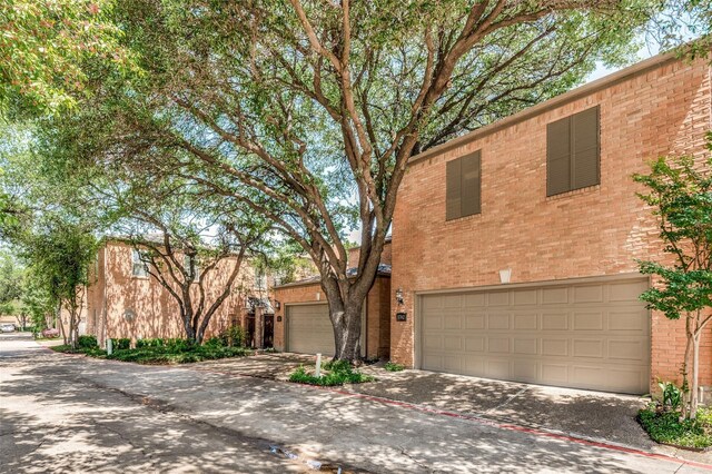 17342 Remington Park Pl, Dallas, TX 75252 - view of front of home with brick siding, concrete driveway, and an attached garage