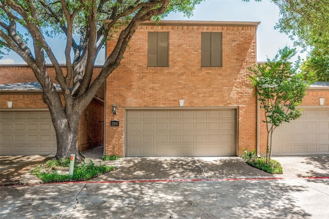 17342 Remington Park Pl, Dallas, TX 75252 - view of front facade with brick siding, an attached garage, and concrete driveway