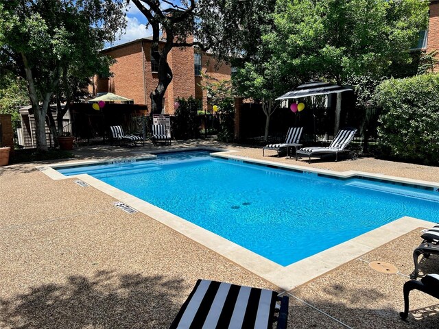 17342 Remington Park Pl, Dallas, TX 75252 - community pool featuring a patio area