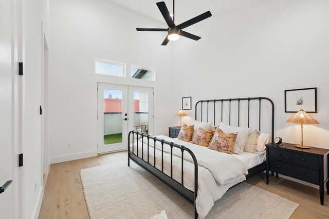 4208 Live Oak St Unit 102, Dallas, TX 75204 - bedroom with light wood-type flooring, french doors, a towering ceiling, a ceiling fan, and access to exterior