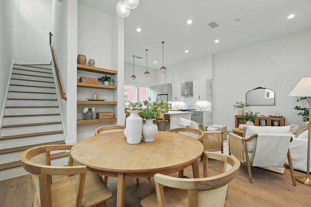4208 Live Oak St Unit 102, Dallas, TX 75204 - dining room with light wood-type flooring, stairs, and recessed lighting