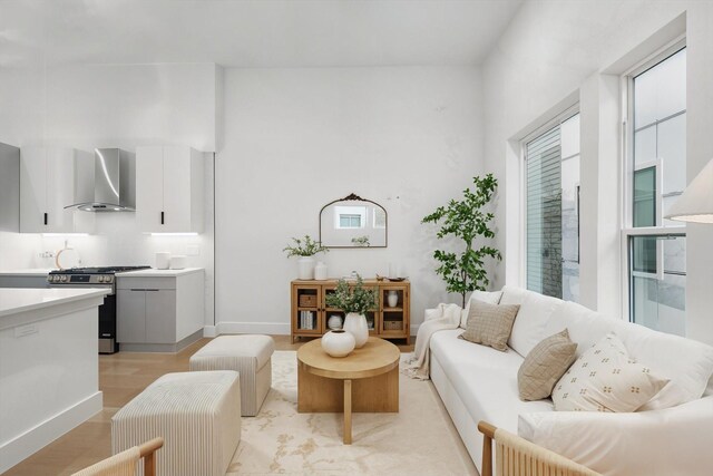 4208 Live Oak St Unit 102, Dallas, TX 75204 - living area with light wood-style flooring and baseboards