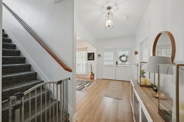 1828 Brown Thrasher Blvd, Savannah, TX 76227 - foyer entrance with arched walkways, light wood-style flooring, and stairs