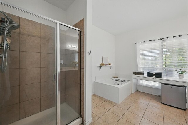 1828 Brown Thrasher Blvd, Savannah, TX 76227 - bathroom with a shower stall, a bath, and tile patterned floors