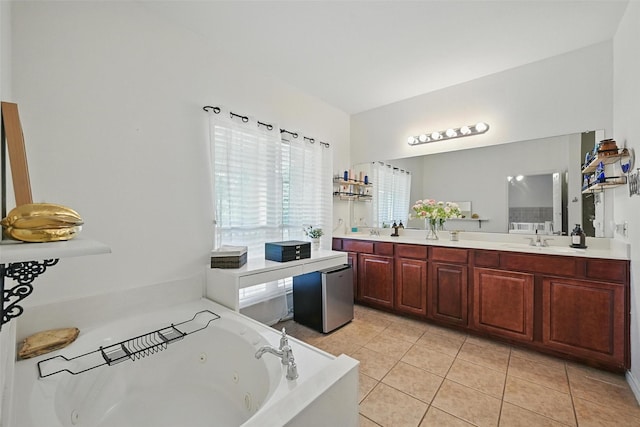 1828 Brown Thrasher Blvd, Savannah, TX 76227 - bathroom with double vanity, a whirlpool tub, and tile patterned floors