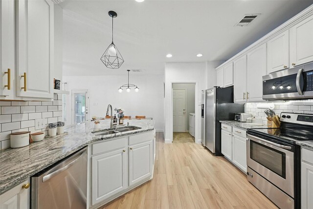 1828 Brown Thrasher Blvd, Savannah, TX 76227 - kitchen featuring appliances with stainless steel finishes, white cabinetry, backsplash, and recessed lighting