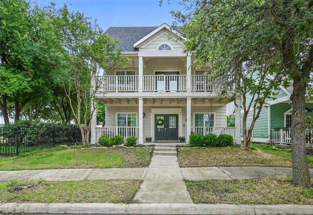 1828 Brown Thrasher Blvd, Savannah, TX 76227 - view of front of home with covered porch, a balcony, french doors, and a shingled roof