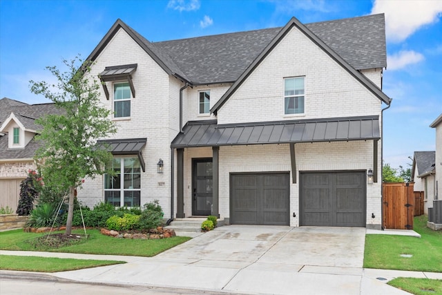 8417 Wembley, The Colony, TX 75056 - view of front of property with a standing seam roof, brick siding, driveway, an attached garage, and a metal roof
