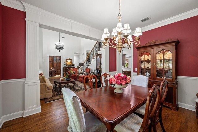 4896 Corinthian Bay Dr, Frisco, TX 75034 - dining area featuring a chandelier, stairway, wood finished floors, ornamental molding, and ornate columns