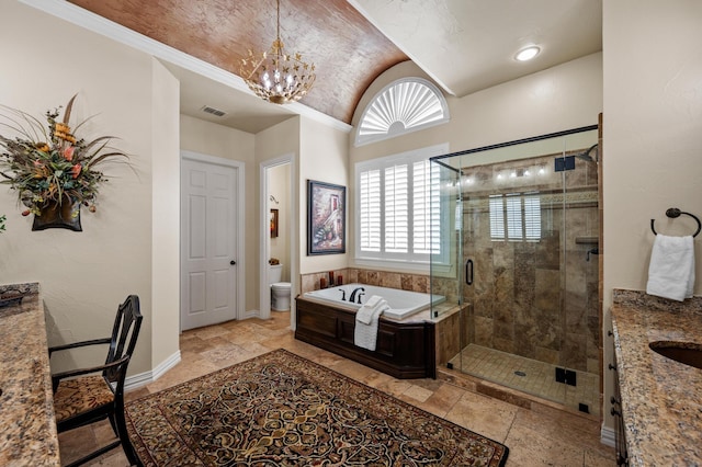4896 Corinthian Bay Dr, Frisco, TX 75034 - bathroom featuring stone tile flooring, a garden tub, a shower stall, vaulted ceiling, and a chandelier