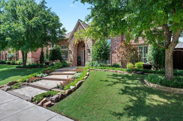 4896 Corinthian Bay Dr, Frisco, TX 75034 - tudor house with brick siding and a front yard