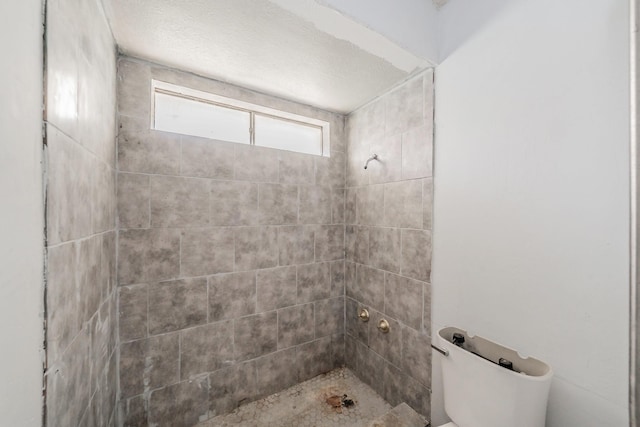 3922 Greenway Dr, Garland, TX 75041 - bathroom with toilet and a tile shower
