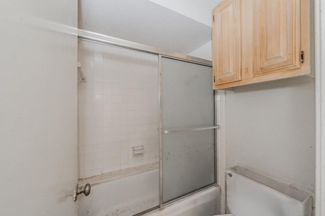 3922 Greenway Dr, Garland, TX 75041 - full bathroom featuring toilet and bath / shower combo with glass door