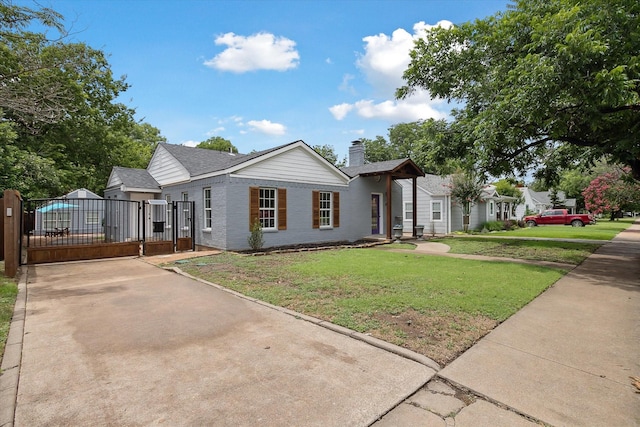 3620 Stadium Dr, Fort Worth, TX 76109 - ranch-style house with a gate, a front lawn, a chimney, and brick siding