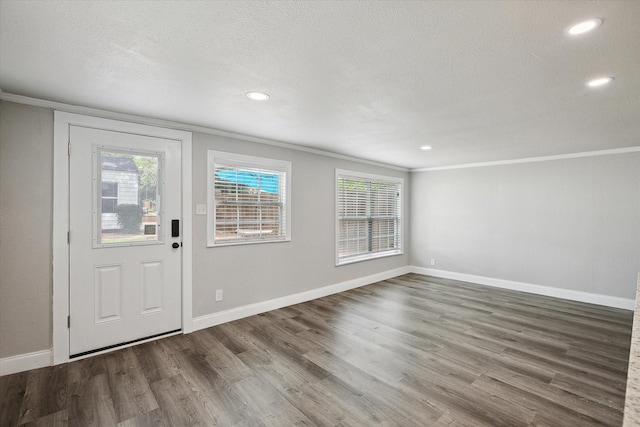 3620 Stadium Dr, Fort Worth, TX 76109 - entryway with ornamental molding, wood finished floors, recessed lighting, and a textured ceiling