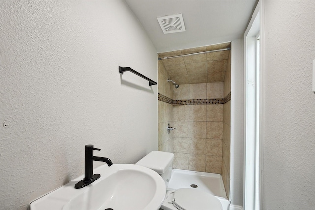 3620 Stadium Dr, Fort Worth, TX 76109 - bathroom with a textured wall and a shower stall