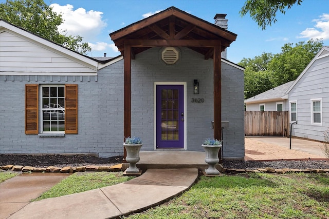 3620 Stadium Dr, Fort Worth, TX 76109 - entrance to property featuring a chimney and brick siding