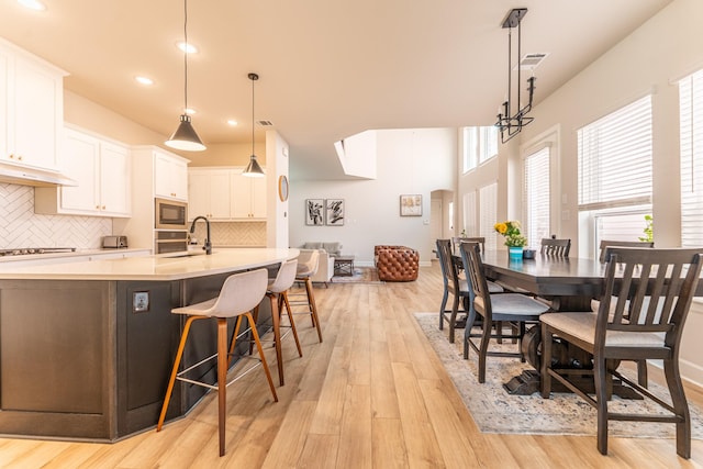 8849 Redding St, North Richland Hills, TX 76180 - dining space with light wood-style floors and recessed lighting