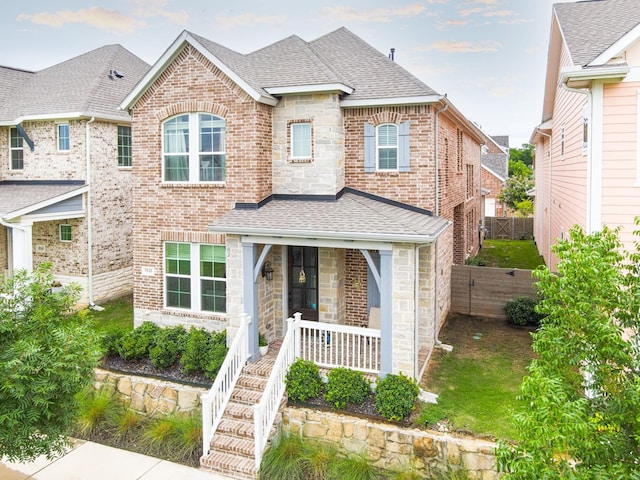 8849 Redding St, North Richland Hills, TX 76180 - view of front of property featuring roof with shingles, stone siding, and brick siding