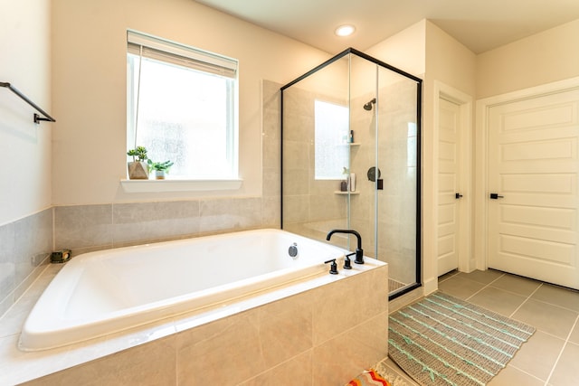 8849 Redding St, North Richland Hills, TX 76180 - full bath with a stall shower, a garden tub, and tile patterned flooring