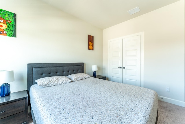 8849 Redding St, North Richland Hills, TX 76180 - carpeted bedroom featuring vaulted ceiling and a closet