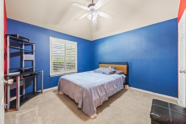 3301 Marymount Dr, Denton, TX 76210 - carpeted bedroom featuring a textured wall, lofted ceiling, and ceiling fan