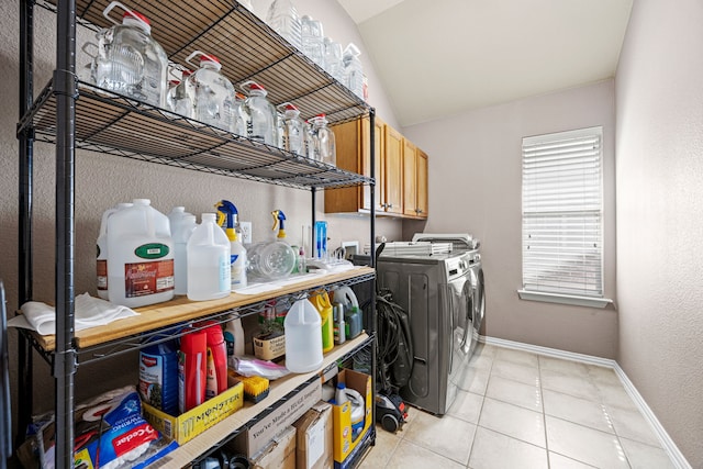 3301 Marymount Dr, Denton, TX 76210 - washroom with washer and dryer, light tile patterned flooring, and cabinet space