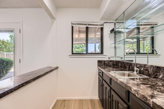 2202 Southern Ct, Carrollton, TX 75006 - bar featuring light wood-style flooring and plenty of natural light