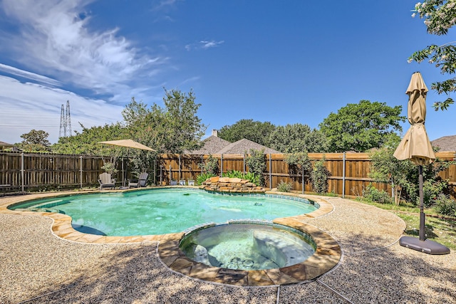 2202 Southern Ct, Carrollton, TX 75006 - view of pool featuring a pool with connected hot tub and a fenced backyard