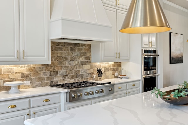 5724 Bellaria Ct, Flower Mound, TX 75022 - kitchen with custom exhaust hood, stainless steel appliances, white cabinets, decorative backsplash, and light stone counters