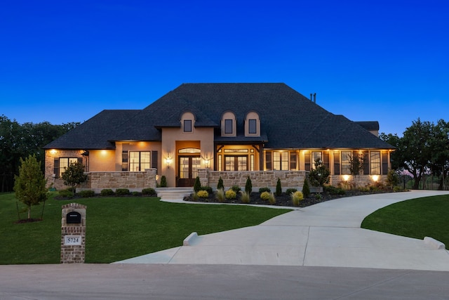5724 Bellaria Ct, Flower Mound, TX 75022 - french country style house with an attached garage, a front yard, driveway, and stone siding