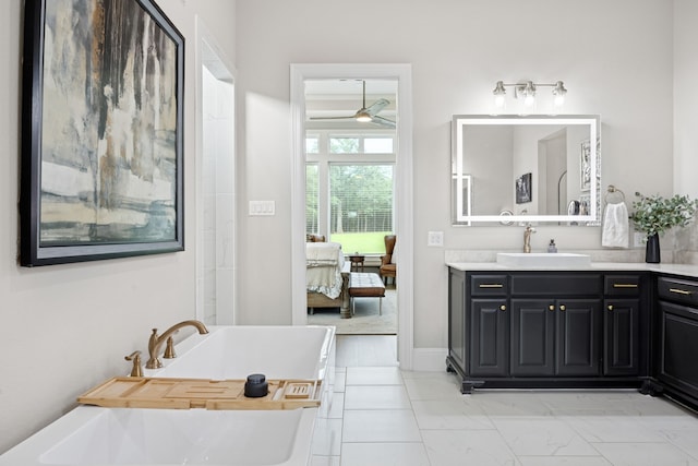5724 Bellaria Ct, Flower Mound, TX 75022 - ensuite bathroom with a ceiling fan, vanity, a soaking tub, and marble look tiles