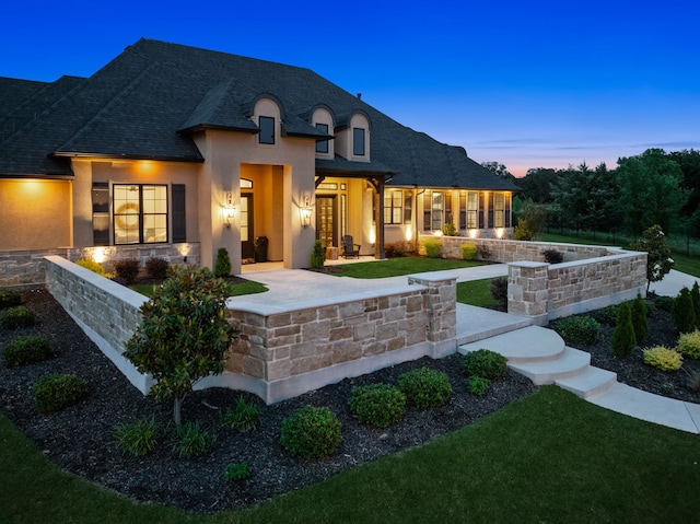 5724 Bellaria Ct, Flower Mound, TX 75022 - french country home with stucco siding, a lawn, and a shingled roof