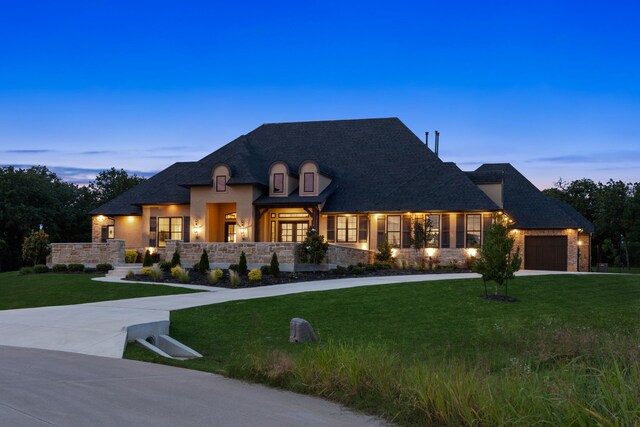5724 Bellaria Ct, Flower Mound, TX 75022 - french country style house with an attached garage, a front yard, driveway, and stone siding