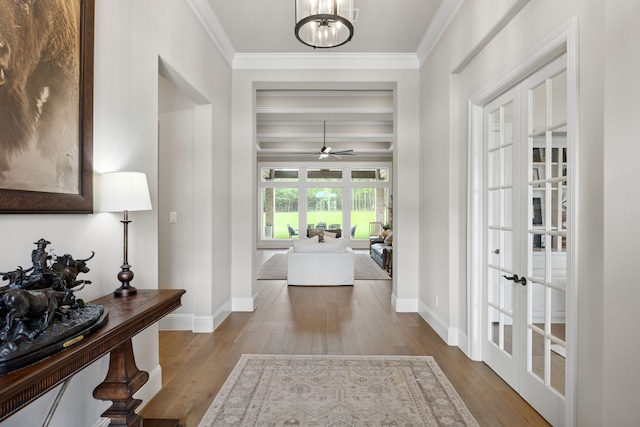 5724 Bellaria Ct, Flower Mound, TX 75022 - foyer featuring wood finished floors, french doors, crown molding, a chandelier, and a ceiling fan