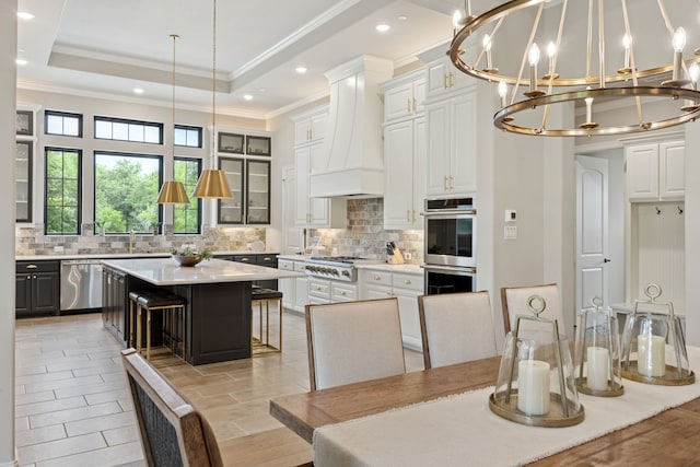 5724 Bellaria Ct, Flower Mound, TX 75022 - kitchen featuring appliances with stainless steel finishes, ornamental molding, light countertops, decorative backsplash, and white cabinetry