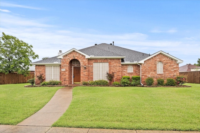 2918 Beau Dr, Mesquite, TX 75181 - view of front facade with brick siding, roof with shingles, and a chimney