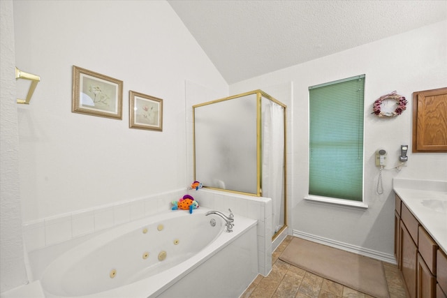 2918 Beau Dr, Mesquite, TX 75181 - full bathroom with a tub with jets, a shower stall, vanity, vaulted ceiling, and a textured ceiling