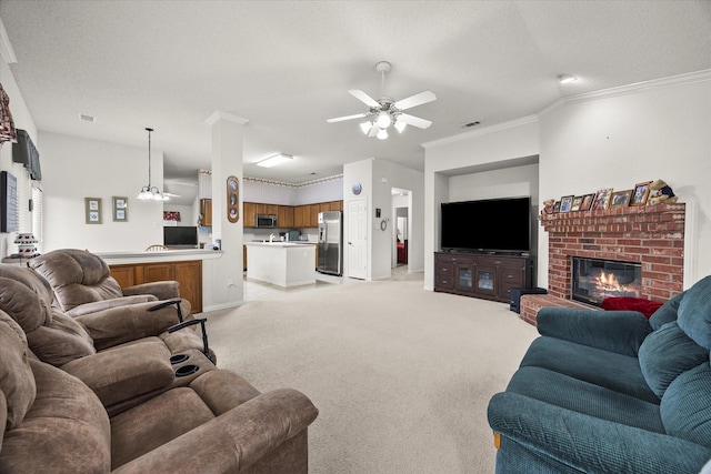 2918 Beau Dr, Mesquite, TX 75181 - living area featuring ceiling fan, a brick fireplace, light colored carpet, and crown molding